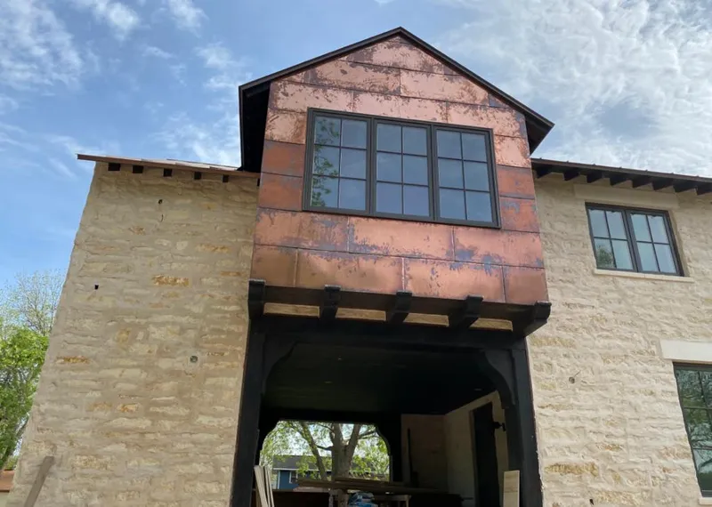 Copper metal panel facade on a stone building for Skylight Installation in Chicago Heights